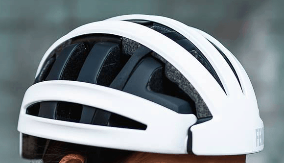 Fend helmet in white worn by person showing side view