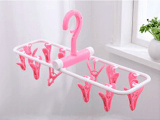 Inoutdoorkit Hanger Rack in pink suspended in air