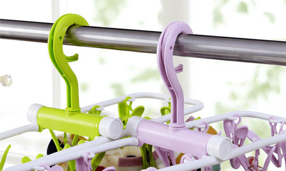 Inoutdoorkit Folding Travel Clip & Drip Laundry Drying Hanger Rack both green and light purple open hanging closeup